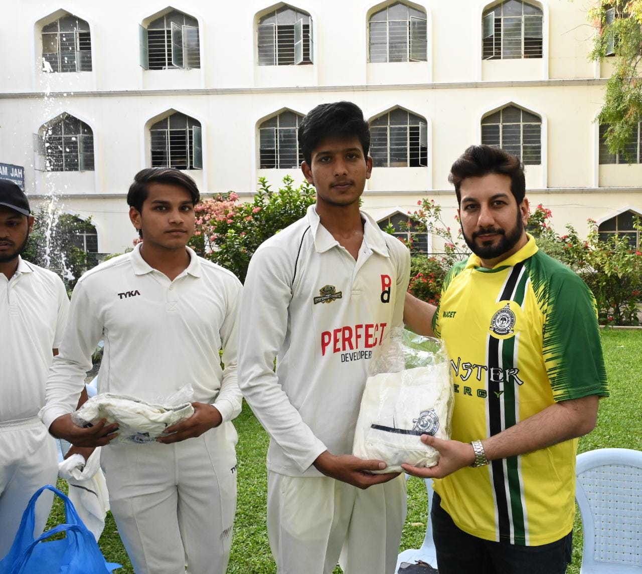 Hon.Secretary SUES Mr. Zafar Javeed & Chairman SDC Mr. Aamer Javeed presenting the cricket kits to the MJCET cricket team.